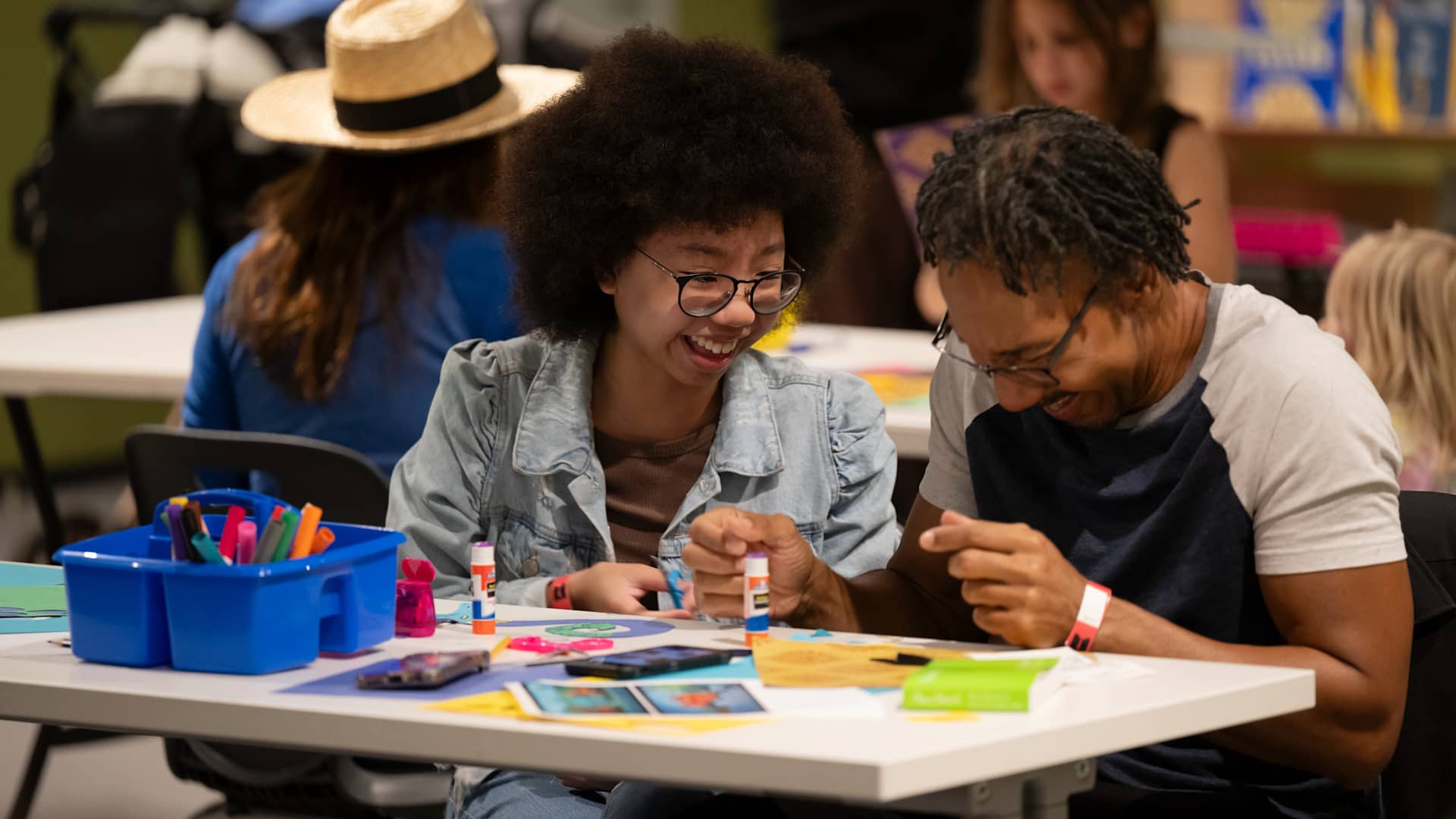 Family doing arts and crafts at table
