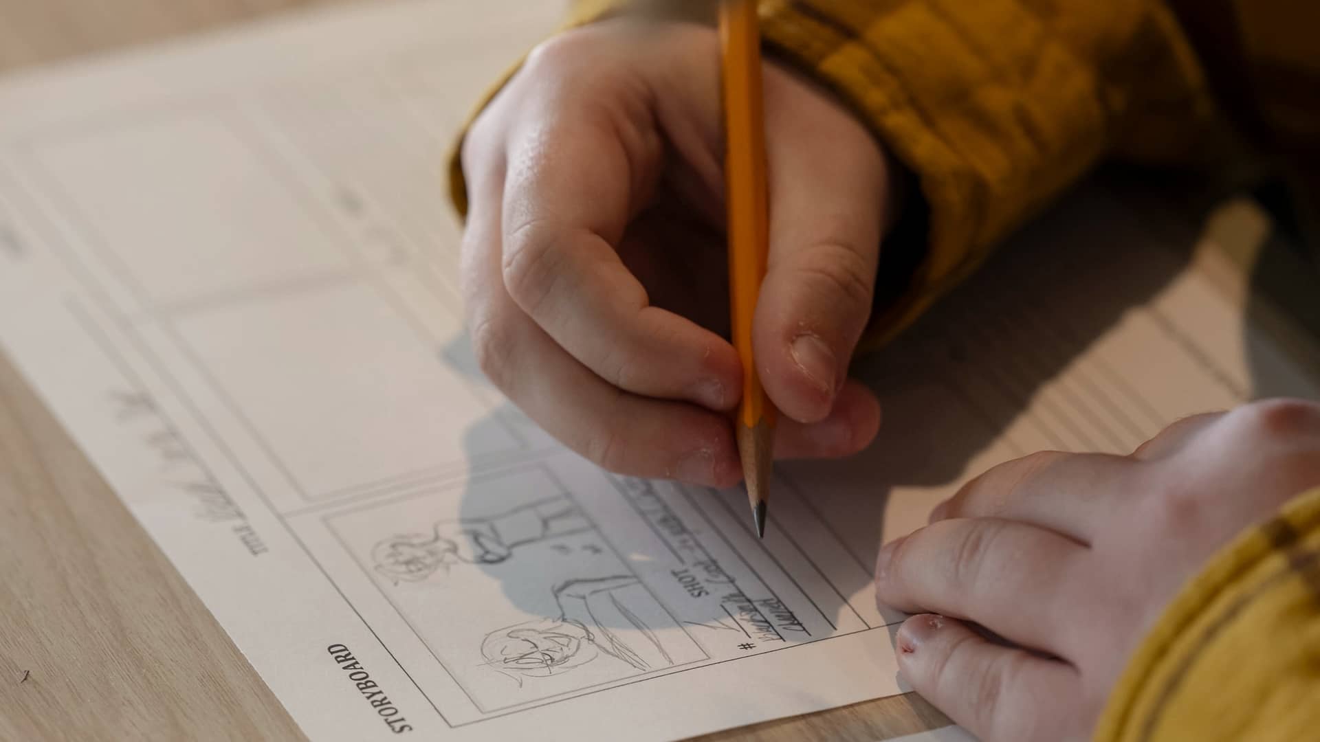 A child drawing a comic