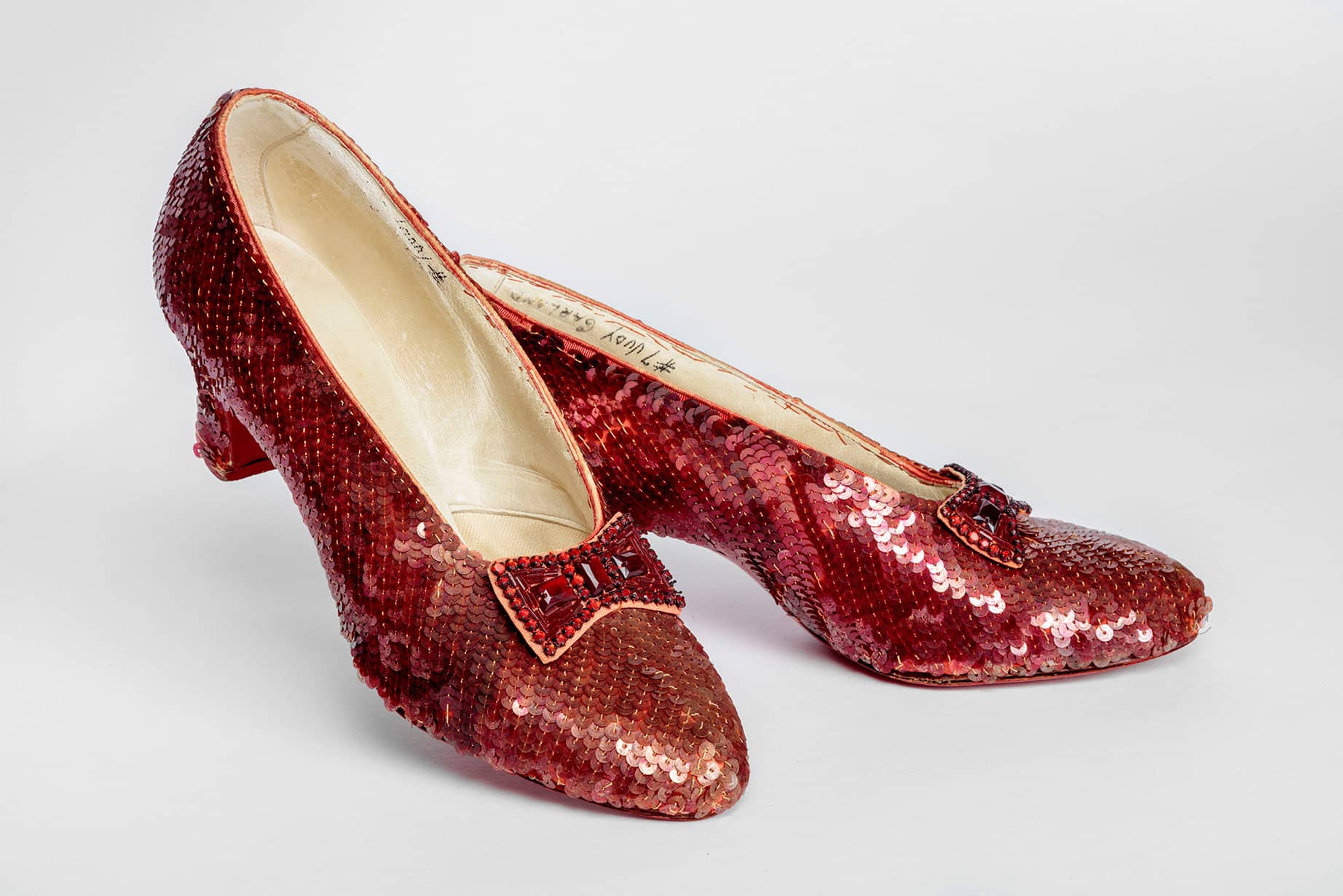 Screen-used close-up pair of the Ruby Slippers, designed by Adrian, from "The Wizard of Oz" (1939). Academy Museum of Motion Pictures. Photo by Joshua White, JWPictures/©Academy Museum Foundation