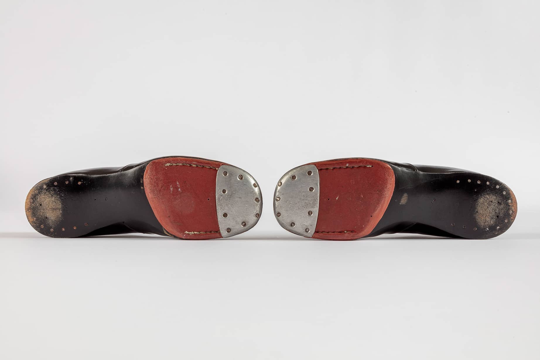 Shirley Temple's tap shoes and practice steps used during filming of <i>The Little Colonel</i> (1935). Academy Museum of Motion Pictures, Gift of Shirley Temple Black and Family. Photo by Joshua White, JWPictures/©Academy Museum Foundation