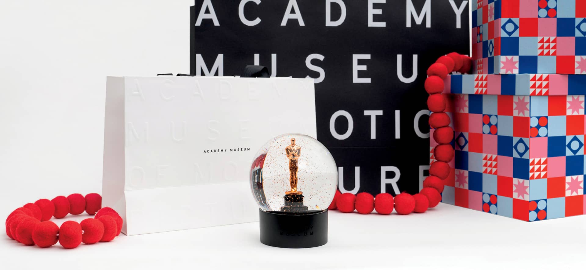 Academy Museum Store Holiday Bags and an Oscar Statuette Globe